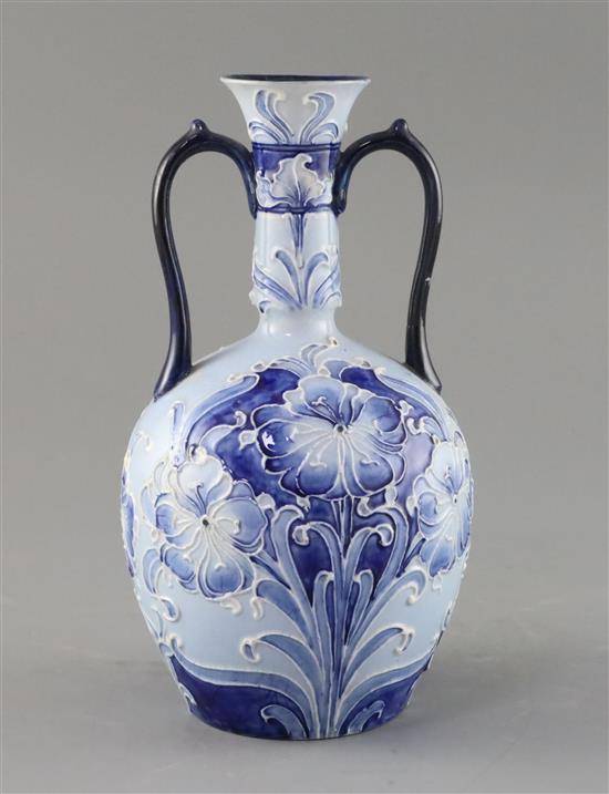 A Moorcroft Florian ware two handled vase, c.1900, H.21.5cm, one handle repaired